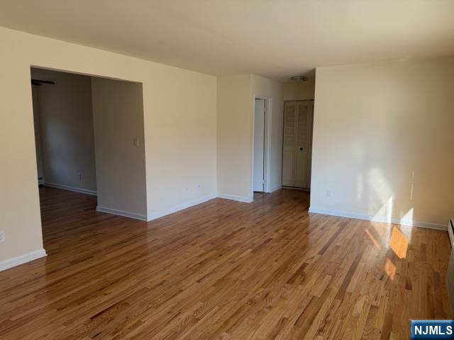 2 Rustic Circle, Unit A Montvale, NJ 07645 - Photo 7 of 7 a view of empty room with wooden floor