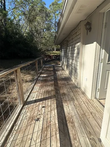 a view of balcony with wooden floor