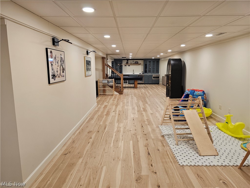 2363 Tabor Ridge Road Northeast New Philadelphia, OH 44663 - Photo 34 of 42 Spacious lower level featuring wood-finish flooring, recessed lighting, and a drop ceiling