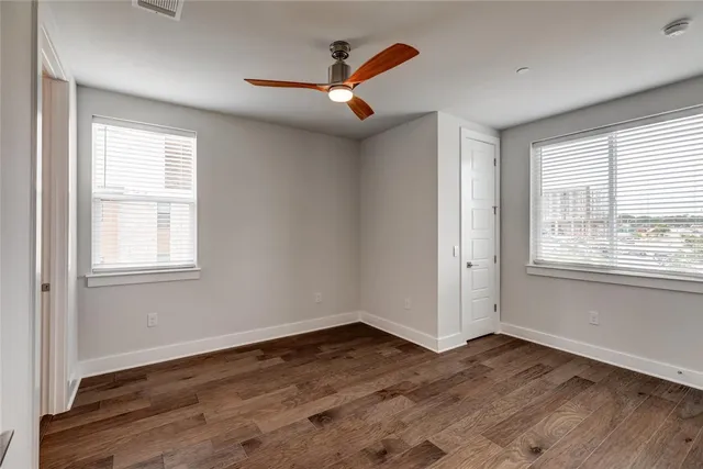 a bathroom with a granite countertop sink a toilet and bathtub