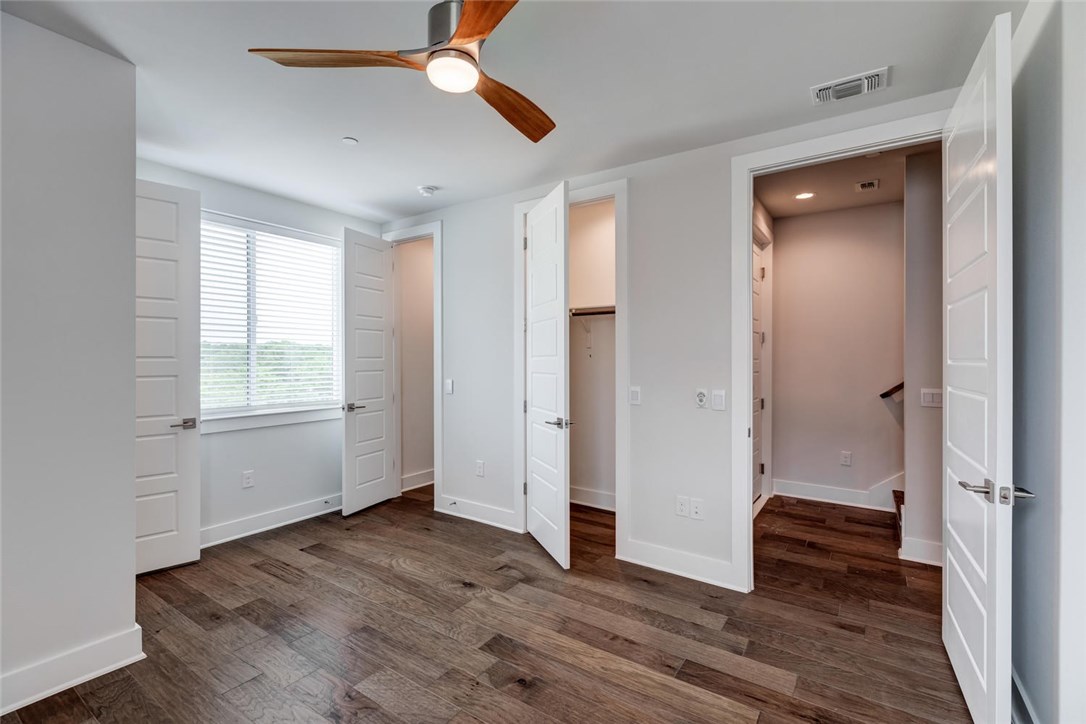 4600 Freedom Drive Austin, TX 78731 - Photo 25 of 40 a view of an empty room with wooden floor and a window