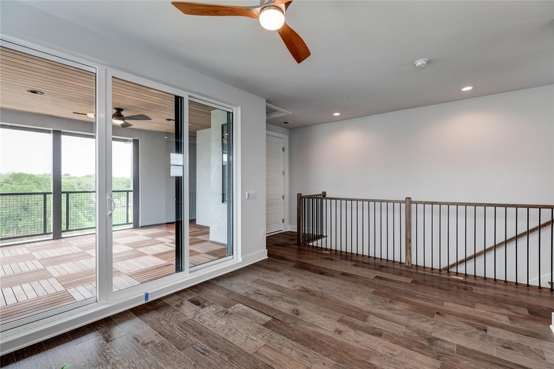 4600 Freedom Drive Austin, TX 78731 - Photo 27 of 40 a view of a room with wooden floor and stairs