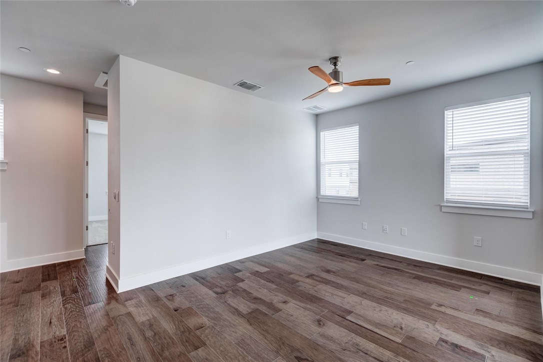 4600 Freedom Drive Austin, TX 78731 - Photo 28 of 40 a view of empty room with wooden floor and fan