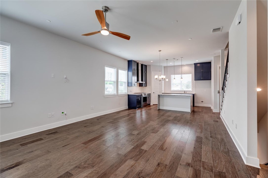 4600 Freedom Drive Austin, TX 78731 - Photo 6 of 40 a view of a kitchen with wooden floor a sink and windows