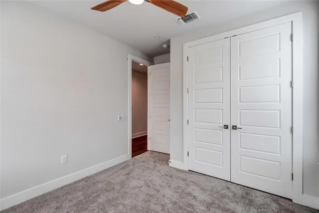 an empty room with closet area