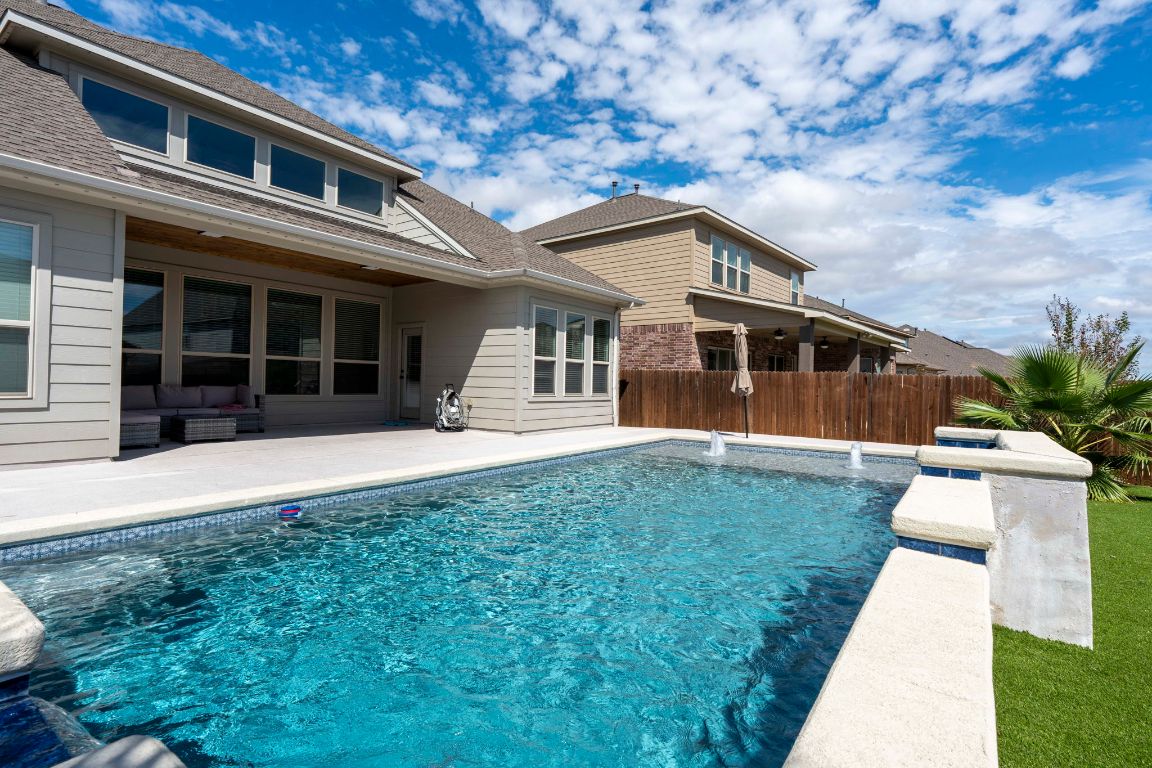 3301 Falconers Way Pflugerville, TX 78660 - Photo 12 of 39 View of swimming pool with a patio and an outdoor hangout area