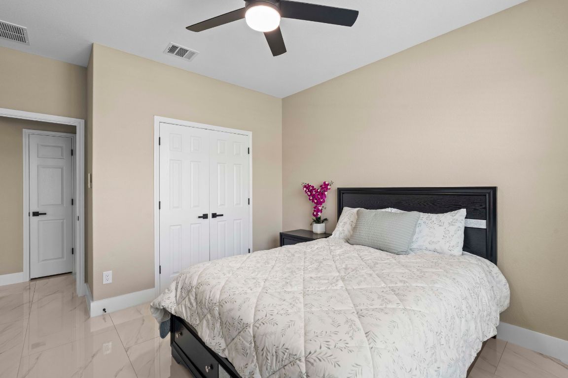 3301 Falconers Way Pflugerville, TX 78660 - Photo 15 of 39 Bedroom featuring a closet and ceiling fan