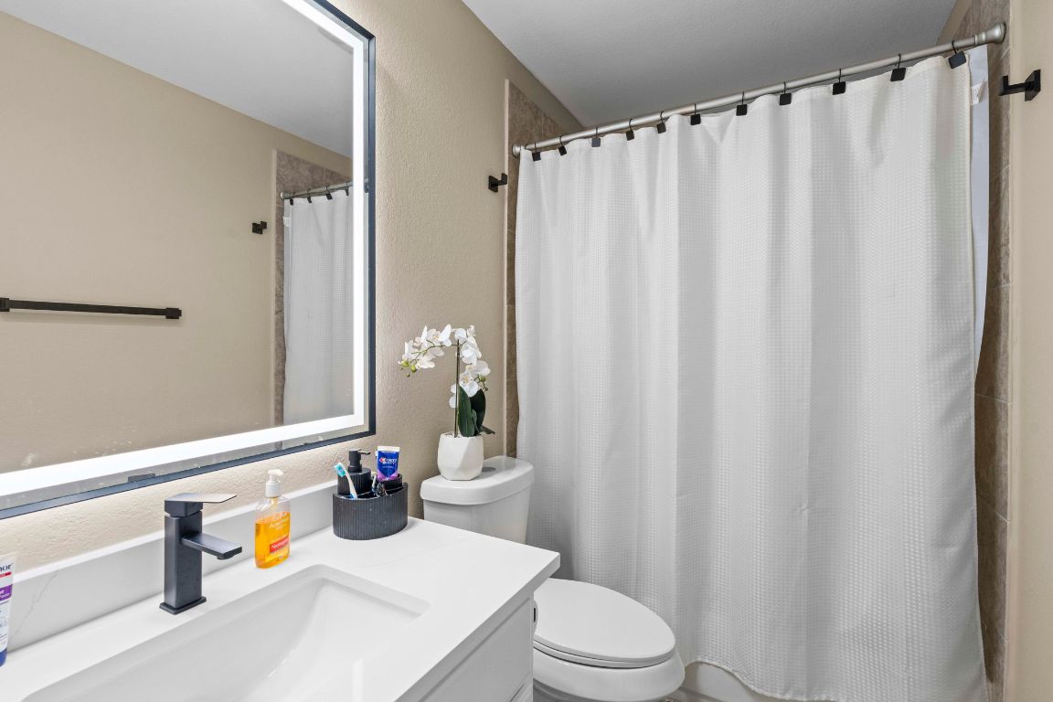 3301 Falconers Way Pflugerville, TX 78660 - Photo 30 of 39 Bathroom with vanity and a textured wall