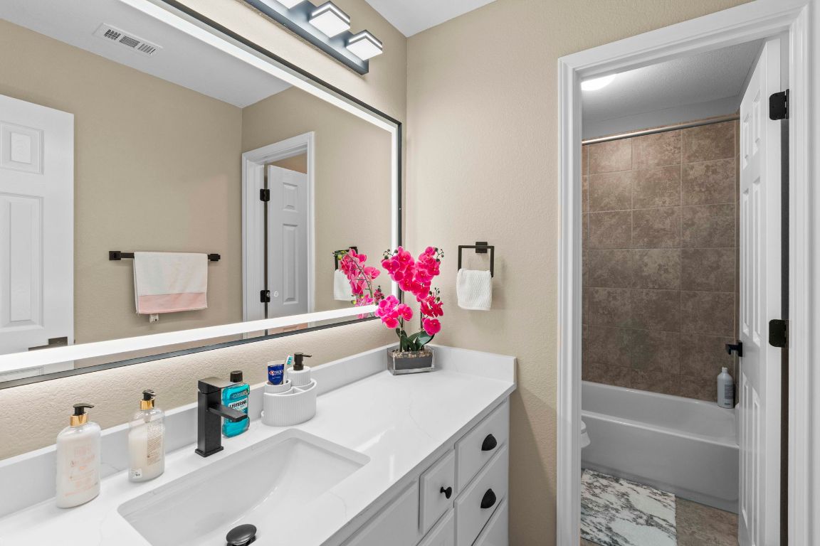 3301 Falconers Way Pflugerville, TX 78660 - Photo 35 of 39 Bathroom featuring vanity and shower / bath combo