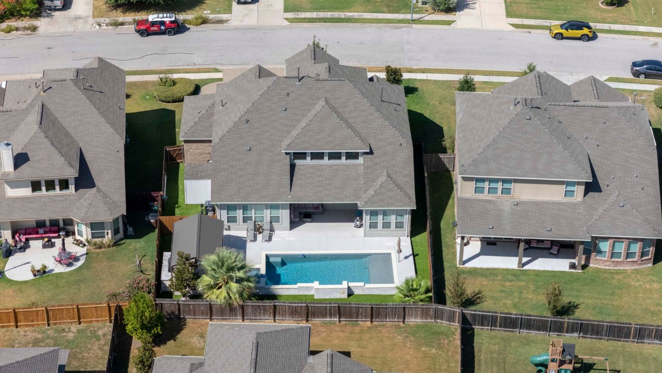 3301 Falconers Way Pflugerville, TX 78660 - Photo 38 of 39 Aerial perspective of suburban area with a pool