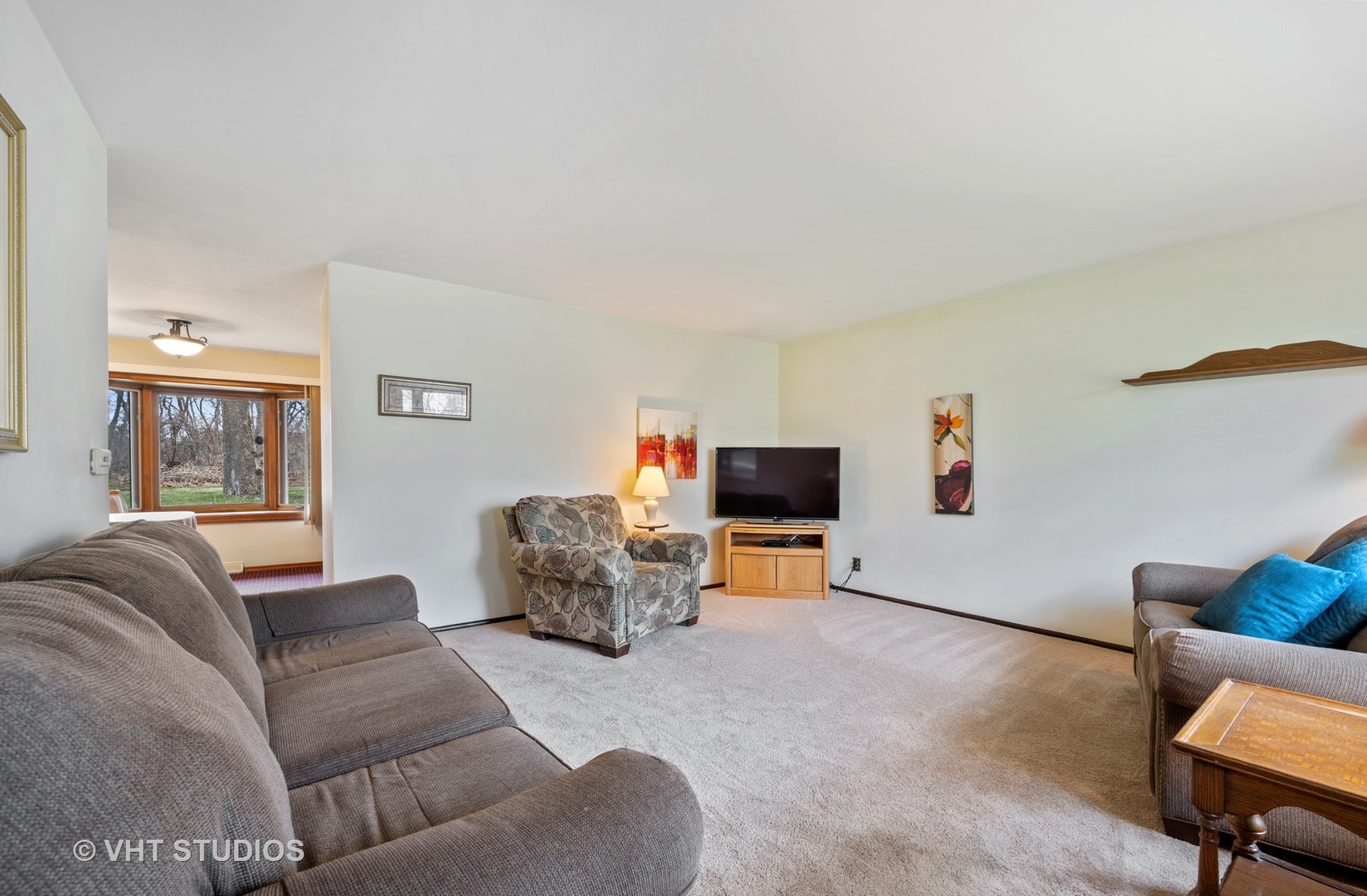 1426 Dunstan Road Geneva, IL 60134 - Photo 3 of 16 a living room with furniture and a flat screen tv