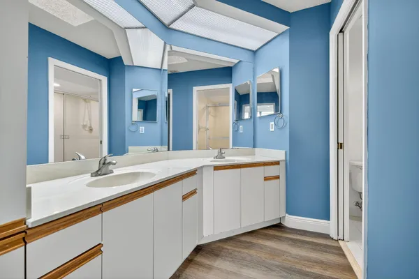 a bathroom with a shower and toilet