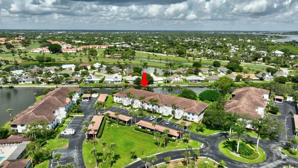 an aerial view of lake and residential houses with outdoor space and lake view