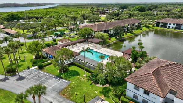 an aerial view of a house with a lake view