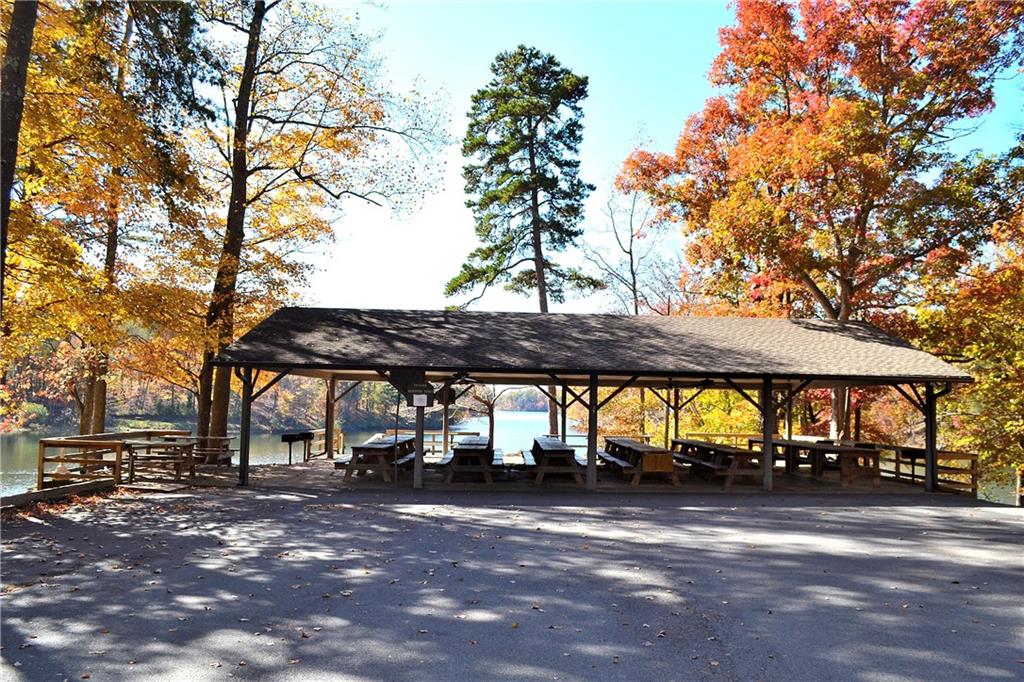 Lt1141 Oglethorpe Mt Road Jasper, GA 30143 - Photo 18 of 26 a view of outdoor space with a table and chairs under an umbrella