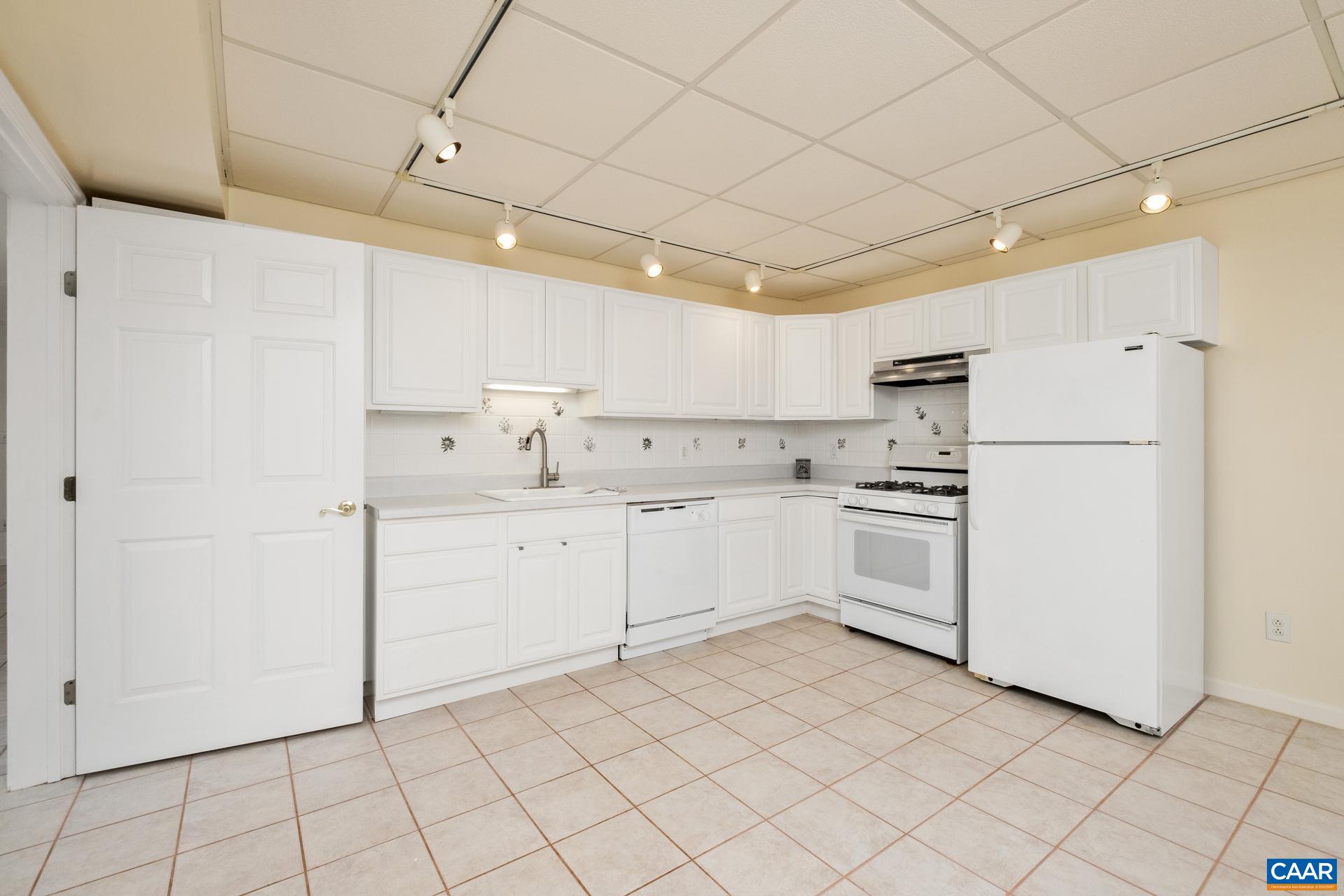 48 Maplevale Drive Palmyra, VA 22963 - Photo 30 of 47 a kitchen with white cabinets and white appliances
