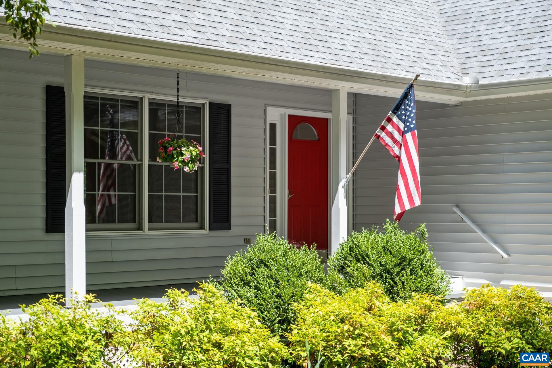 48 Maplevale Drive Palmyra, VA 22963 - Photo 40 of 47 a view of yellow house with a large window and flower plants