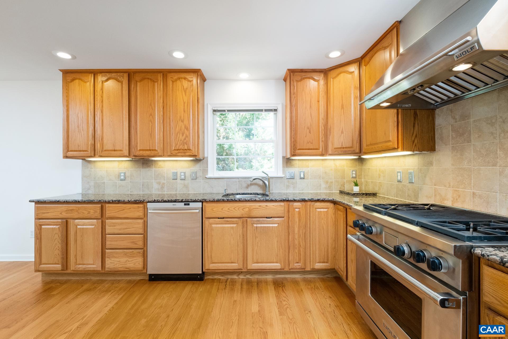 48 Maplevale Drive Palmyra, VA 22963 - Photo 6 of 47 a kitchen with stainless steel appliances granite countertop a stove a sink and a microwave