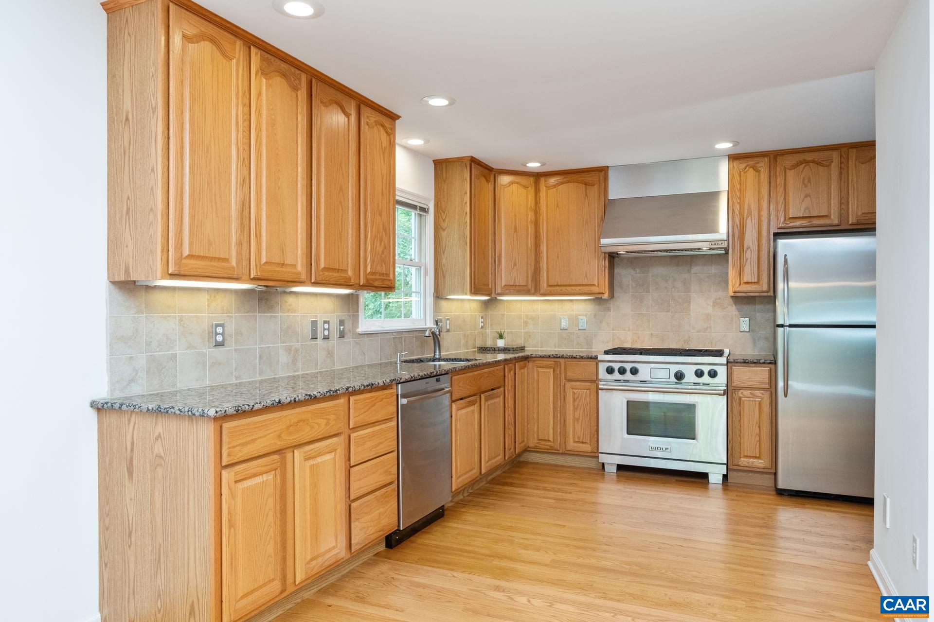 48 Maplevale Drive Palmyra, VA 22963 - Photo 8 of 47 a kitchen with stainless steel appliances granite countertop a stove a sink and a refrigerator
