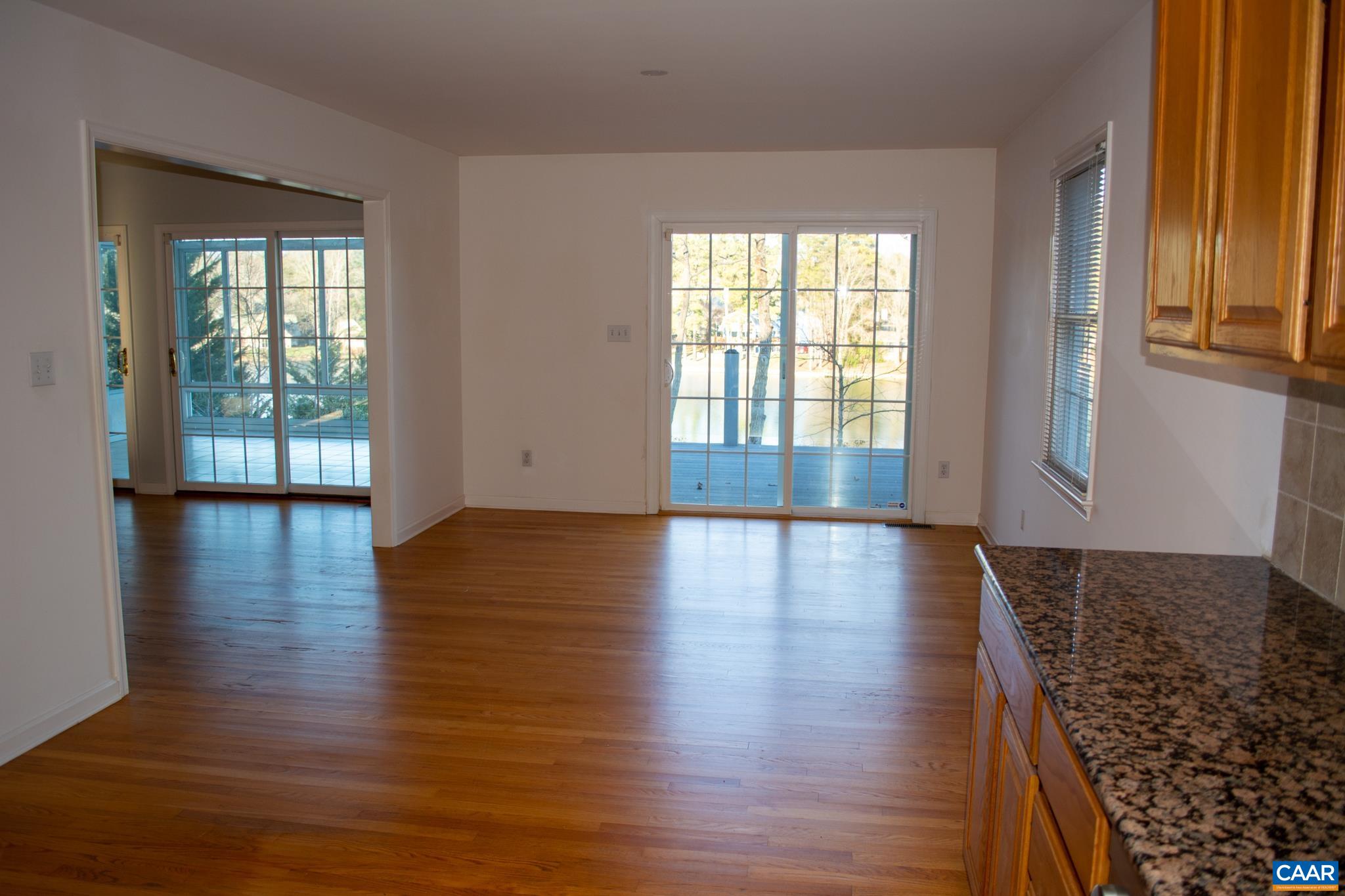48 Maplevale Drive Palmyra, VA 22963 - Photo 9 of 47 an empty room with wooden floor and windows