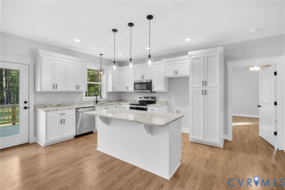 19106 Carson Road Dinwiddie, VA 23841 - Photo 3 of 34 Kitchen featuring white cabinetry, light-toned gra