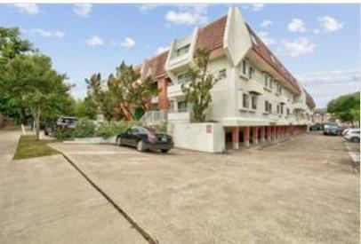 3115 Helms Street, Unit 316 Austin, TX 78705 - Photo 14 of 19 a view of a building with many windows