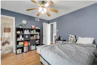 3115 Helms Street, Unit 316 Austin, TX 78705 - Photo 19 of 19 a bedroom with a bed a window and closet