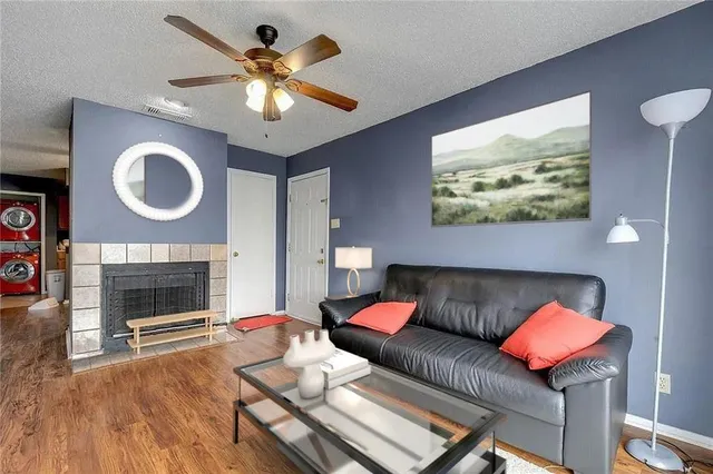 a living room with furniture and a fireplace