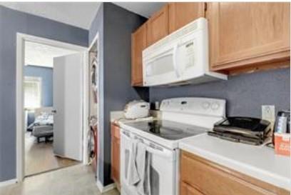 3115 Helms Street, Unit 316 Austin, TX 78705 - Photo 7 of 19 a kitchen that has a sink and a stove