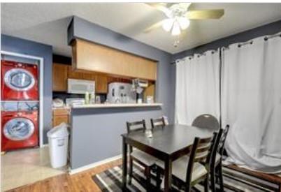 3115 Helms Street, Unit 316 Austin, TX 78705 - Photo 8 of 19 a view of a dining room with furniture and chandelier