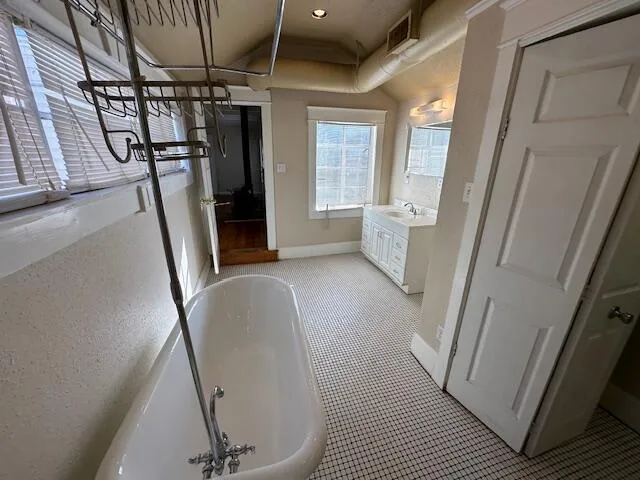 a view of a hallway with furniture and stairs