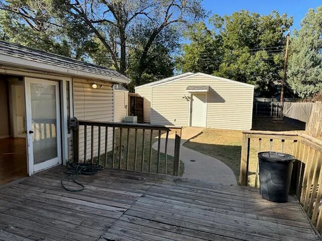 a view of a deck with furniture and wooden floor