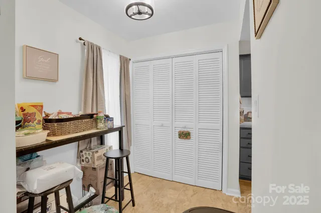 a room with a table and chairs