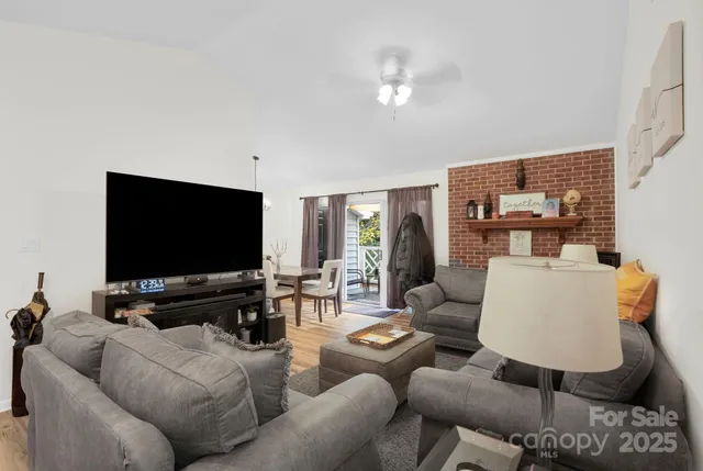 a living room with furniture and a flat screen tv
