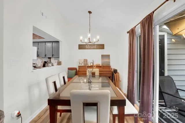 a view of a dining room with furniture and window
