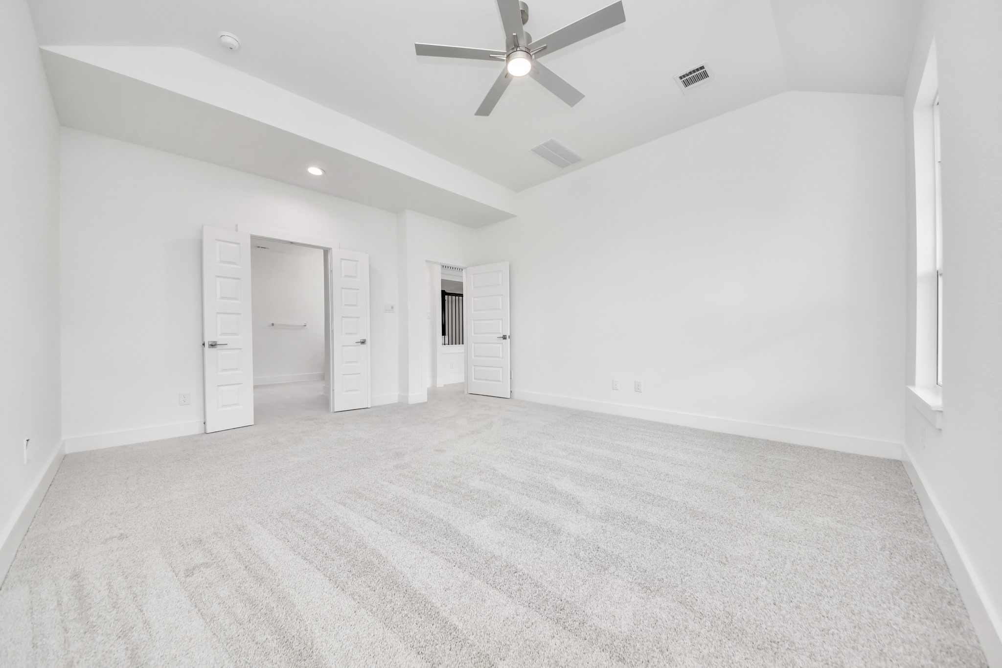 3038 Native Spg Drive Spring, TX 77373 - Photo 23 of 44 Come and unwind after a long day in this magnificent primary suite! This spacious room features plush carpet, warm paint, high ceilings and large windows with privacy blinds.