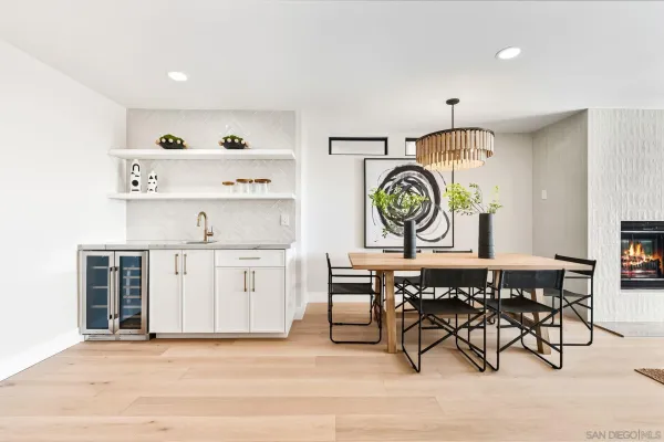 a living room with lots of furniture and a painting