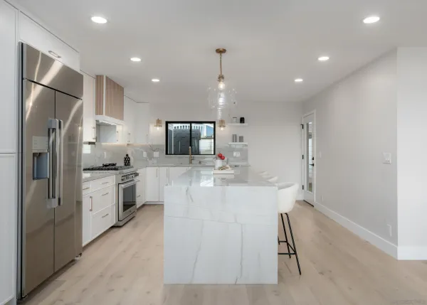 a kitchen with a sink stove and cabinets