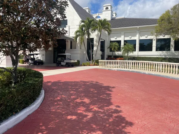 a view of a building with a yard