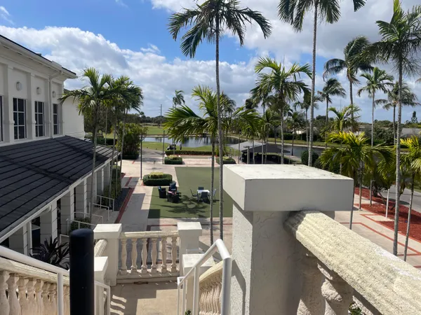 a view of a backyard and swimming pool