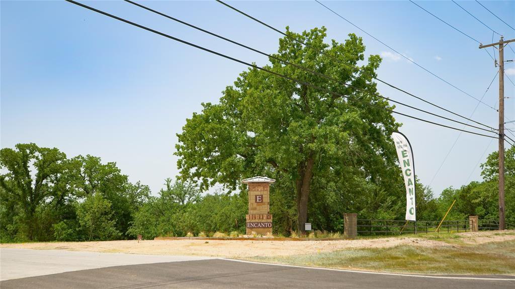 8009 Encanto Way Azle, TX 76020 - Photo 8 of 8 a view of a tall building with a tree in the background