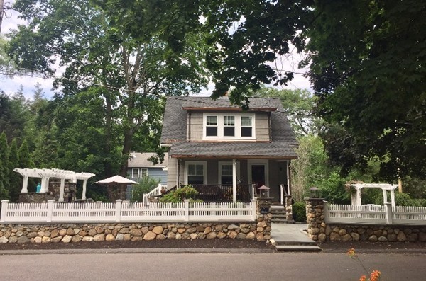 front view of a house with a small yard