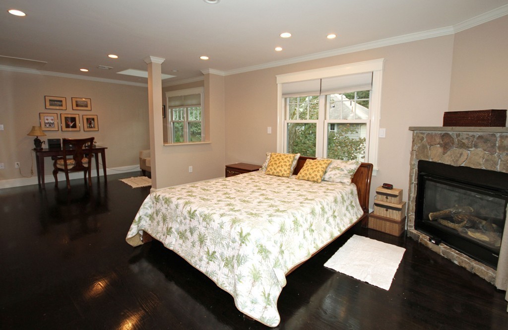 1 Stevens Road Wellesley, MA 02482 - Photo 12 of 18 a bed sitting in a room next to a window