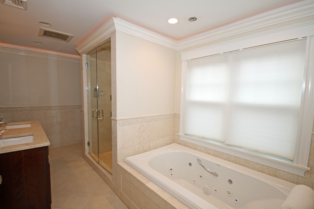 1 Stevens Road Wellesley, MA 02482 - Photo 14 of 18 a bathroom with a bathtub and a shower