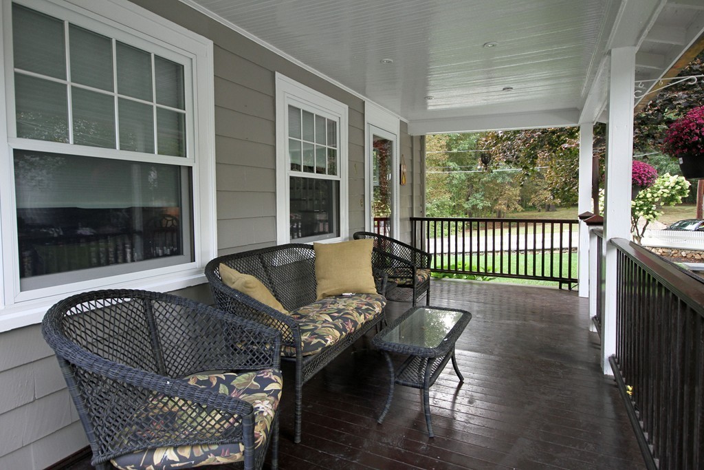 1 Stevens Road Wellesley, MA 02482 - Photo 3 of 18 a balcony with furniture and a potted plant