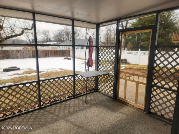 a view of a porch with wooden floor
