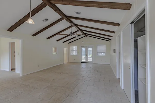 a view of a hallway with windows