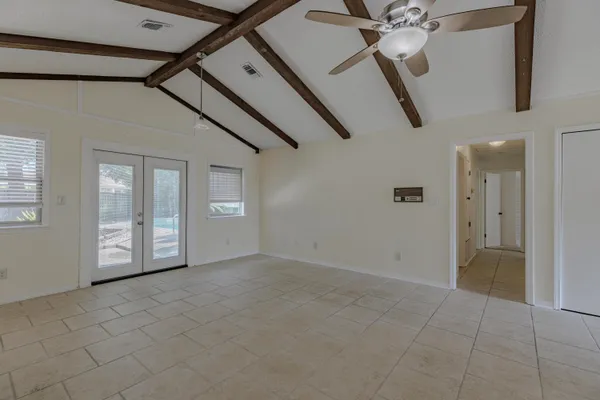 a view of an empty room with a window