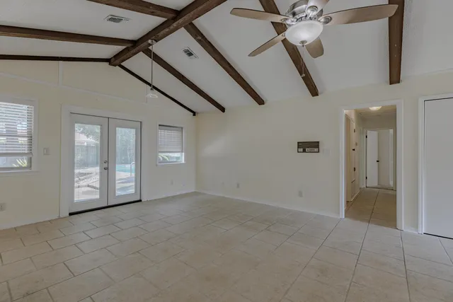 a view of an empty room with a window