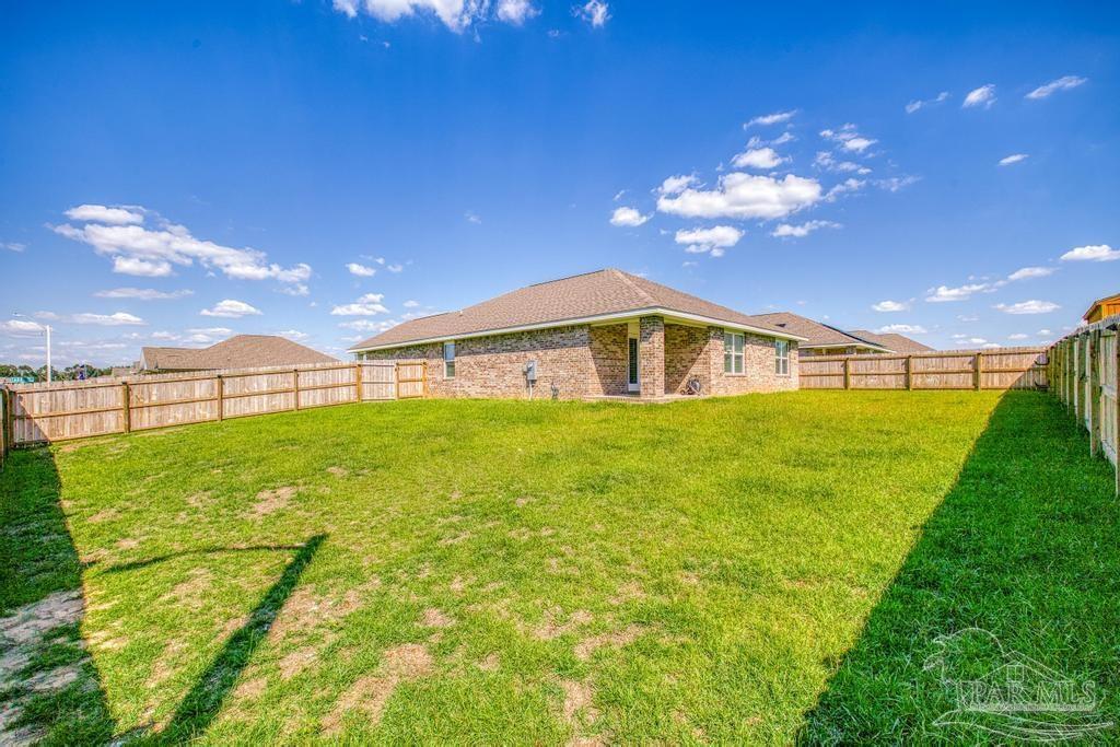 9336 Tara Circle Milton, FL 32583 - Photo 13 of 45 a very nice looking yard with a house